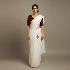 Elegant White Saree with Contrast Maroon Sparkle Velvet Blouse