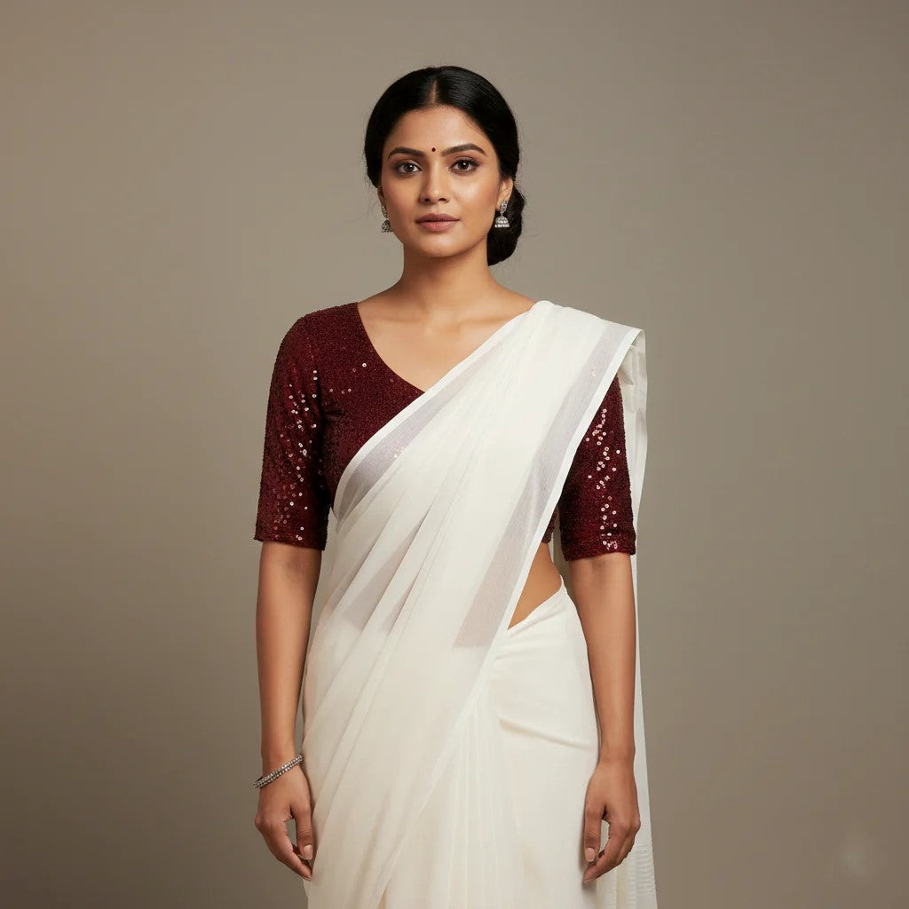 Elegant White Saree with Contrast Maroon Sparkle Velvet Blouse