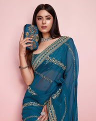 Innovative Teal Blue Color Taby Silk Saree